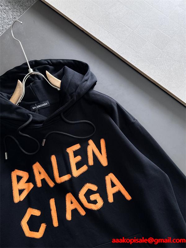 バレンシアガ コピー パーカー ホワイト オレンジロゴ 手書き風 プリントデザイン カジュアル ストリート BALENCIAGA