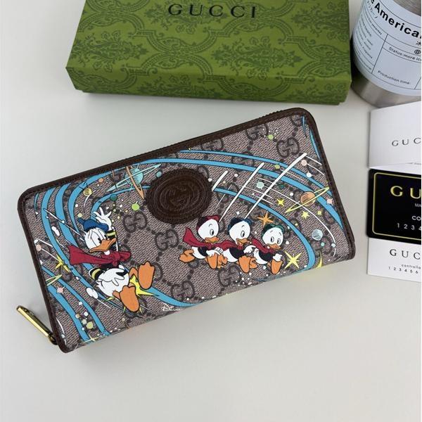 GUCCI コピー ラウンドファスナー長財布 ドナルドダック GGスプリーム キャンバス N級品 グッチ 