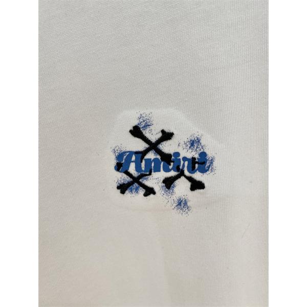 アミリ コピー ワンポイン AMIRI トロゴ 半袖Tシャツ クロスモチーフ ホワイト ブラック クルーネック シンプルボディ