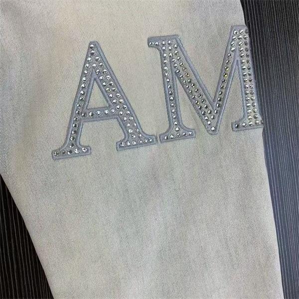 ダメージクラッシュデニム AMIRI アミリ コピー ジーンズ ビッグロゴ ワッペン加工 ヴィンテージウォッシュ 人気