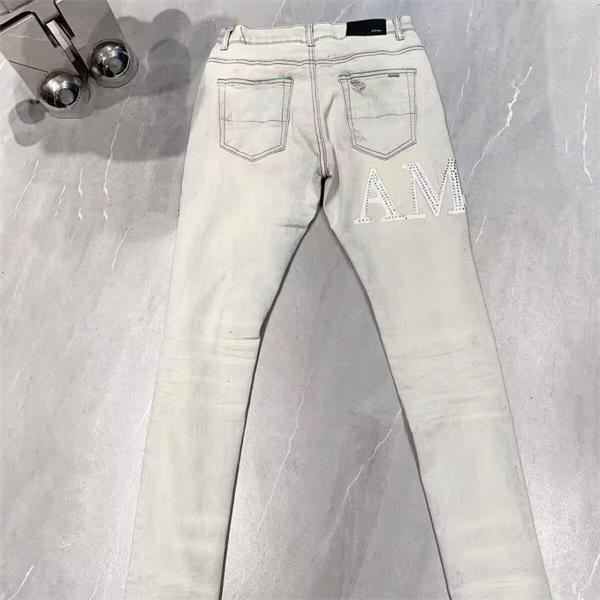 ダメージクラッシュデニム AMIRI アミリ コピー ジーンズ ビッグロゴ ワッペン加工 ヴィンテージウォッシュ 人気