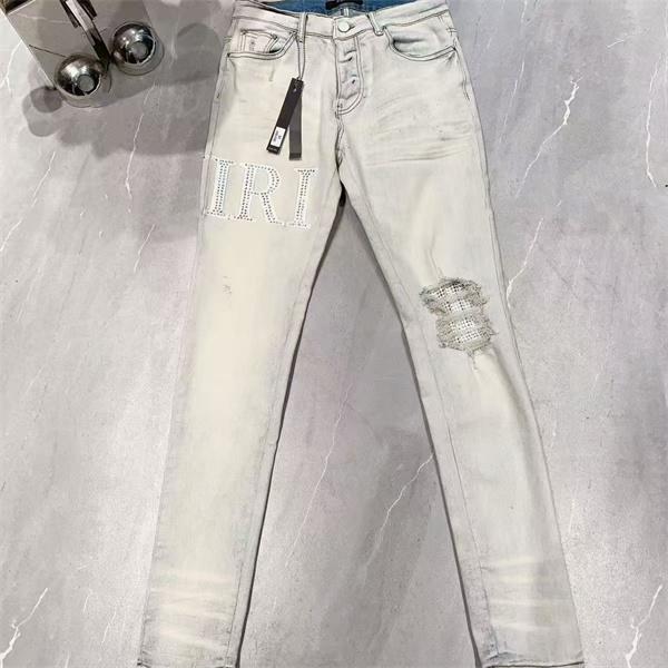 ダメージクラッシュデニム AMIRI アミリ コピー ジーンズ ビッグロゴ ワッペン加工 ヴィンテージウォッシュ 人気