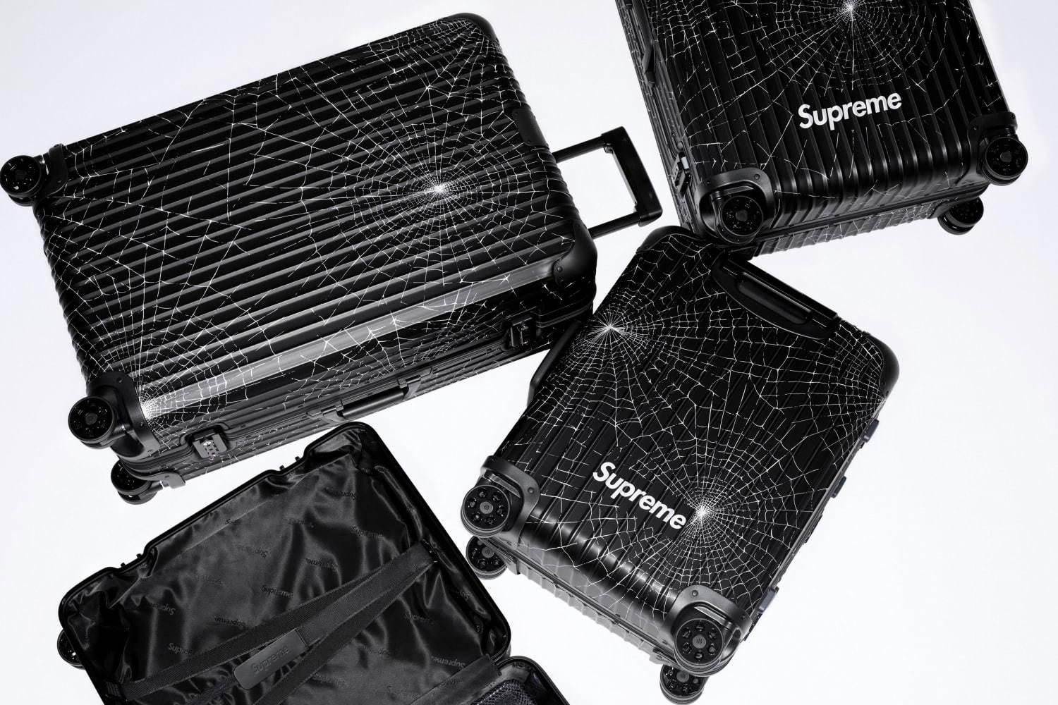 シュプリーム×リモワの限定スーツケース、スパイダー ウェブ＆ロゴを配したブラックアルミニウム 