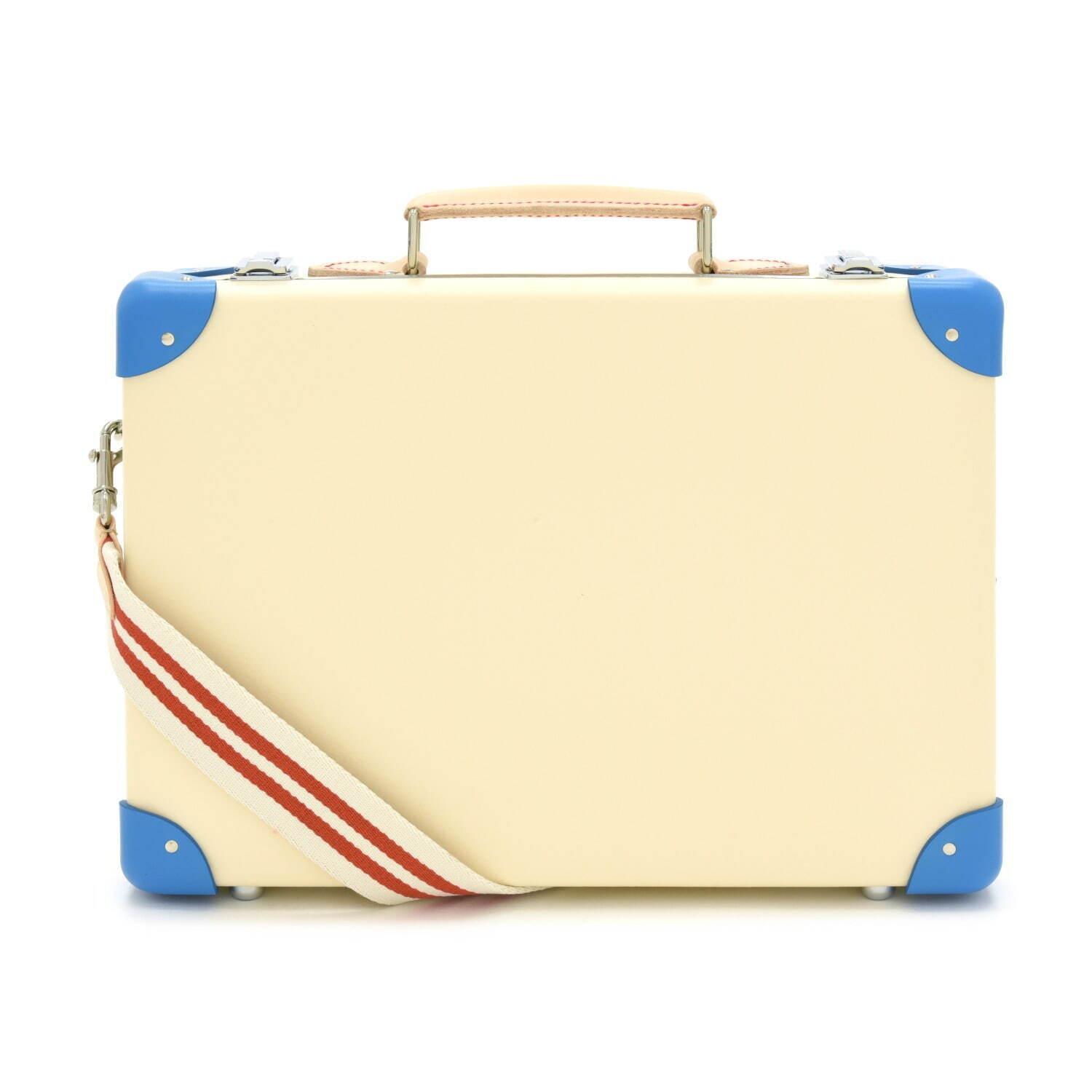 グローブ・トロッター“英国の家族旅行”着想のストライプ柄スーツケース、白い砂浜×青い海カラー コピー