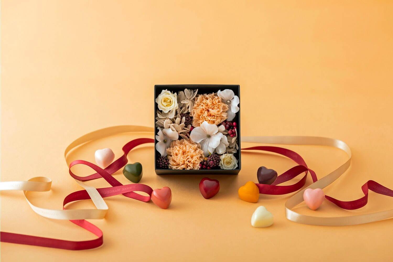ピエール マルコリーニ母の日限定チョコボックス、オレンジのカーネーション入りフラワーボックスを添えて コピー ピエール マルコリーニ母の日限定チョコボックス、オレンジのカーネーション入りフラワーボックスを添えて コピー
